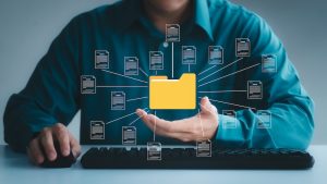 Document management system concept, business man holding folder and document icon software.